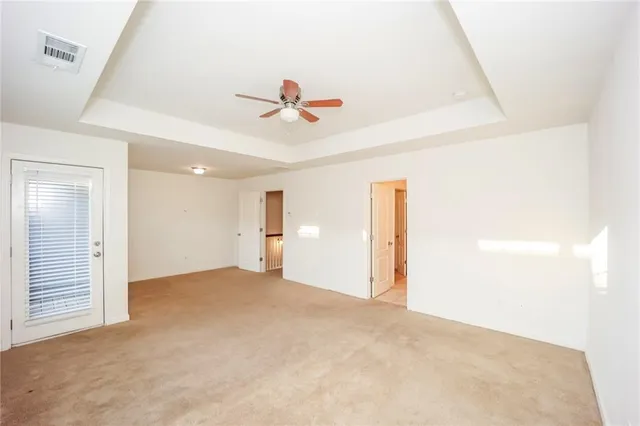 a spacious bathroom with a shower sink and mirror