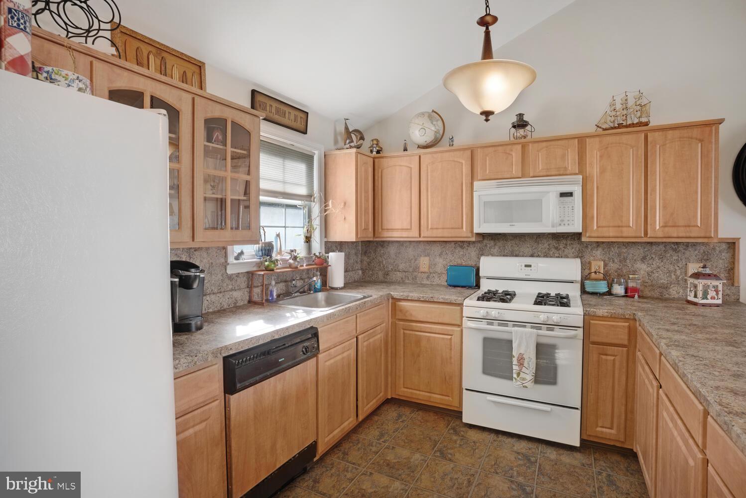 1321 Radio Road Little Egg Harbor, NJ 08087 - Photo 15 of 32 a kitchen with a white cabinets and window