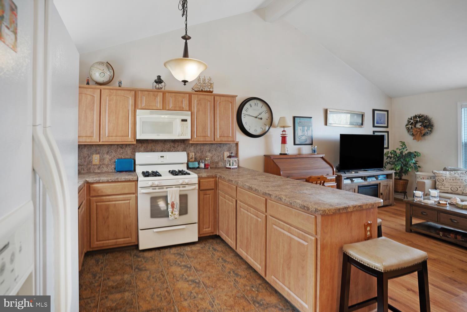 1321 Radio Road Little Egg Harbor, NJ 08087 - Photo 16 of 32 a kitchen with a stove and a clock