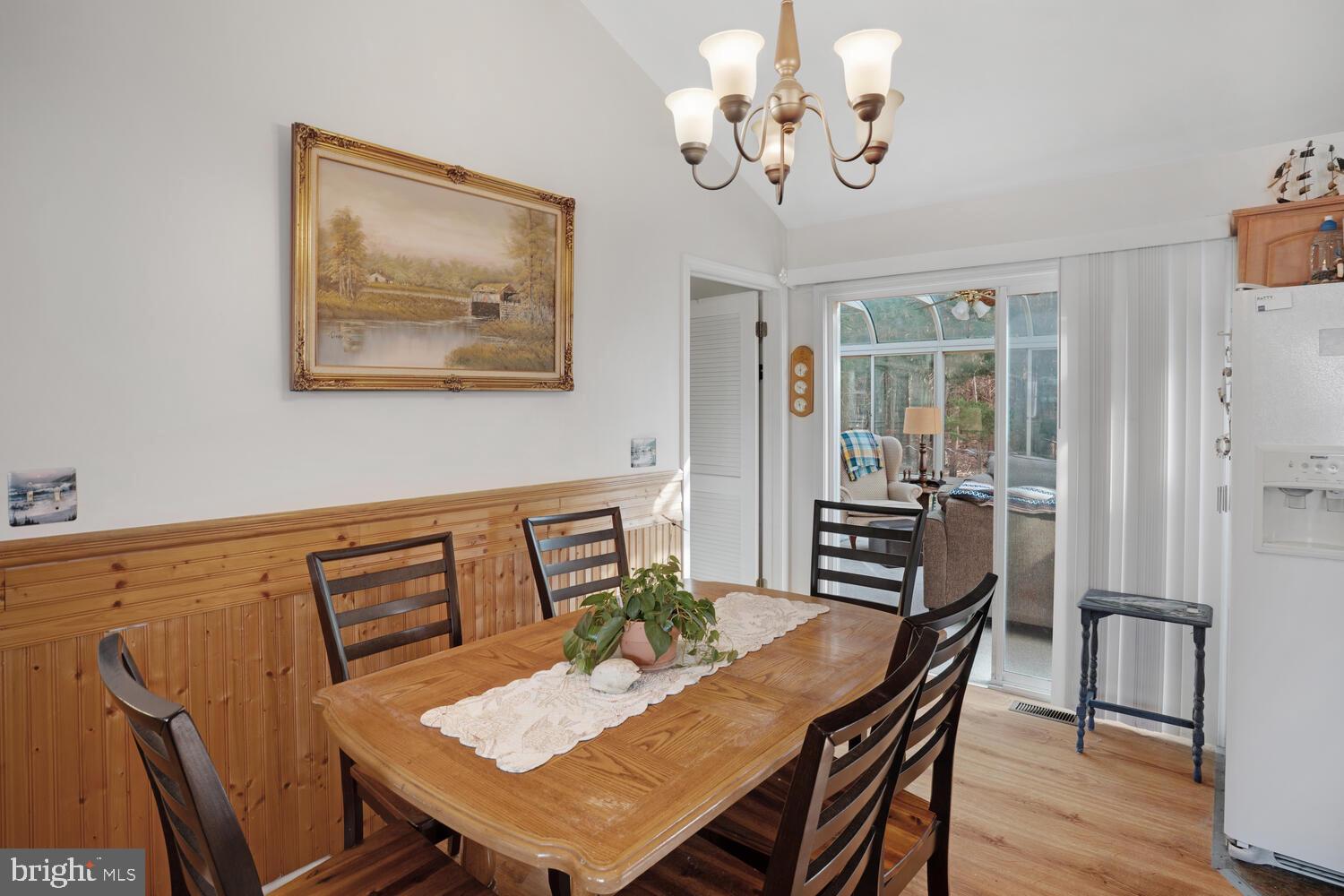 1321 Radio Road Little Egg Harbor, NJ 08087 - Photo 18 of 32 a view of a dining room with furniture wooden floor and a chandelier