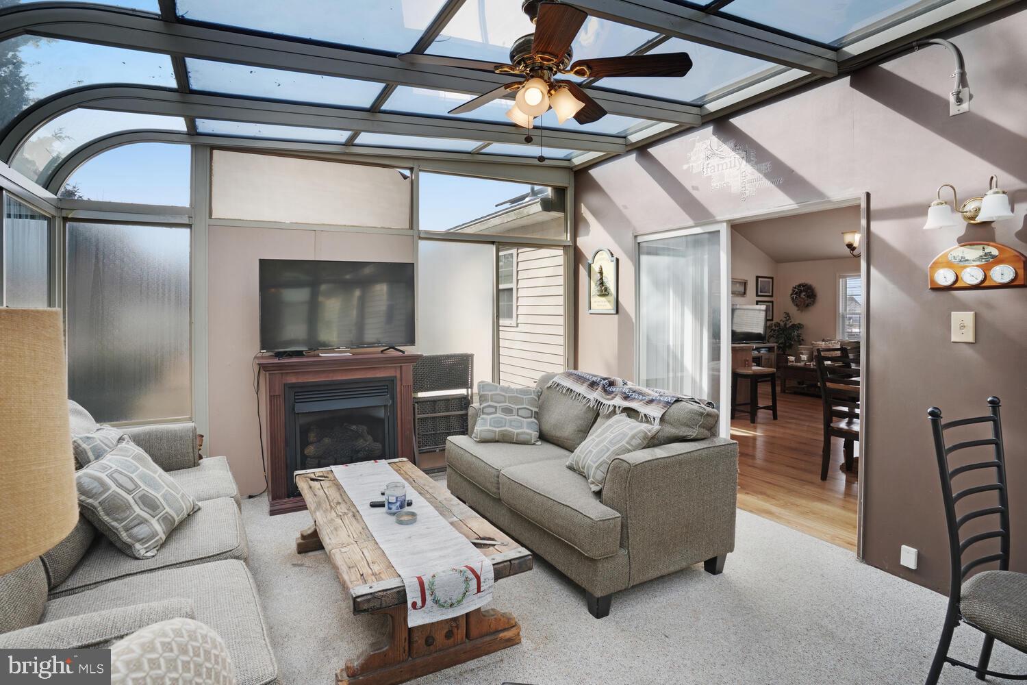 1321 Radio Road Little Egg Harbor, NJ 08087 - Photo 20 of 32 a living room with furniture and a floor to ceiling window