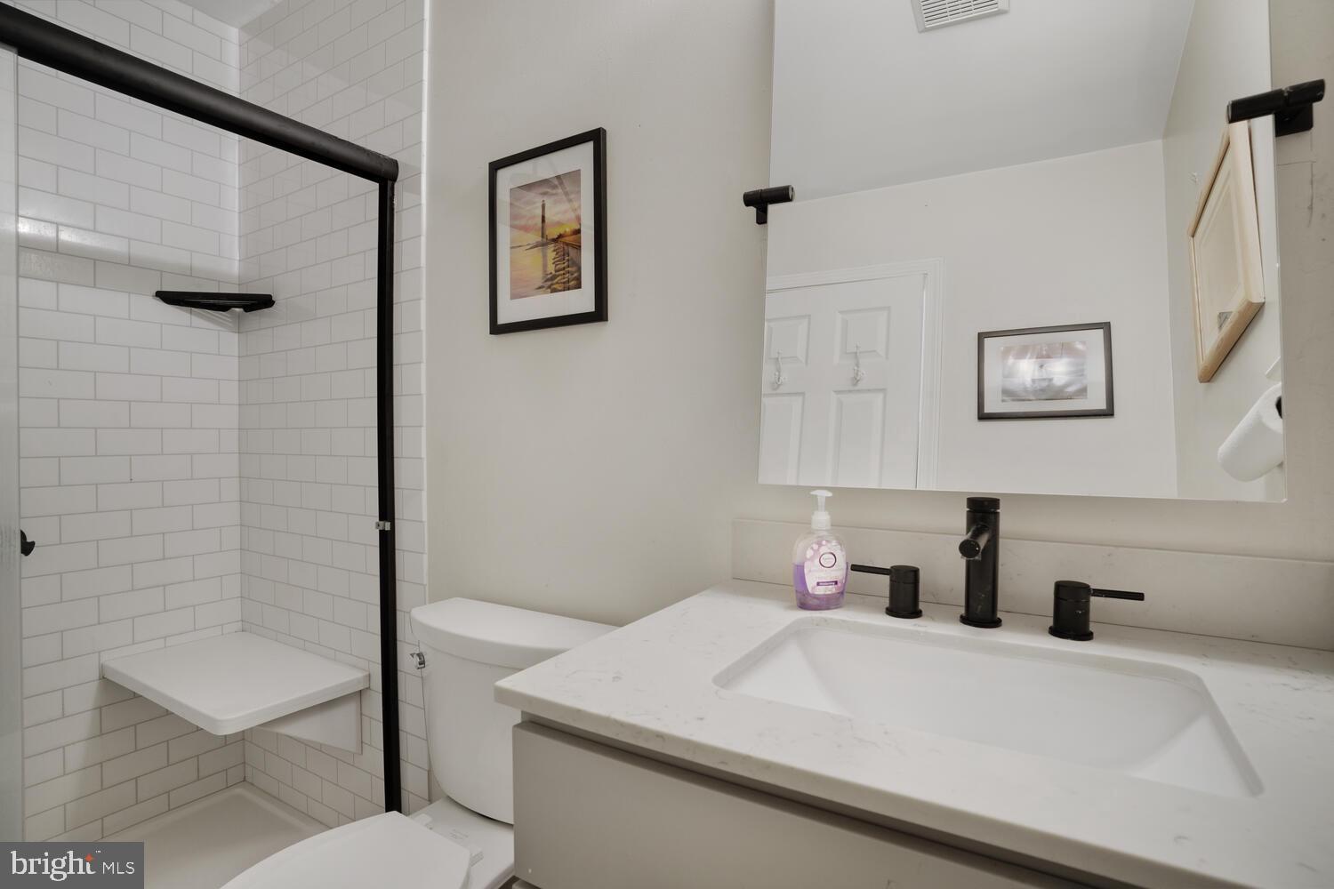1321 Radio Road Little Egg Harbor, NJ 08087 - Photo 22 of 32 a bathroom with a sink a toilet and shower