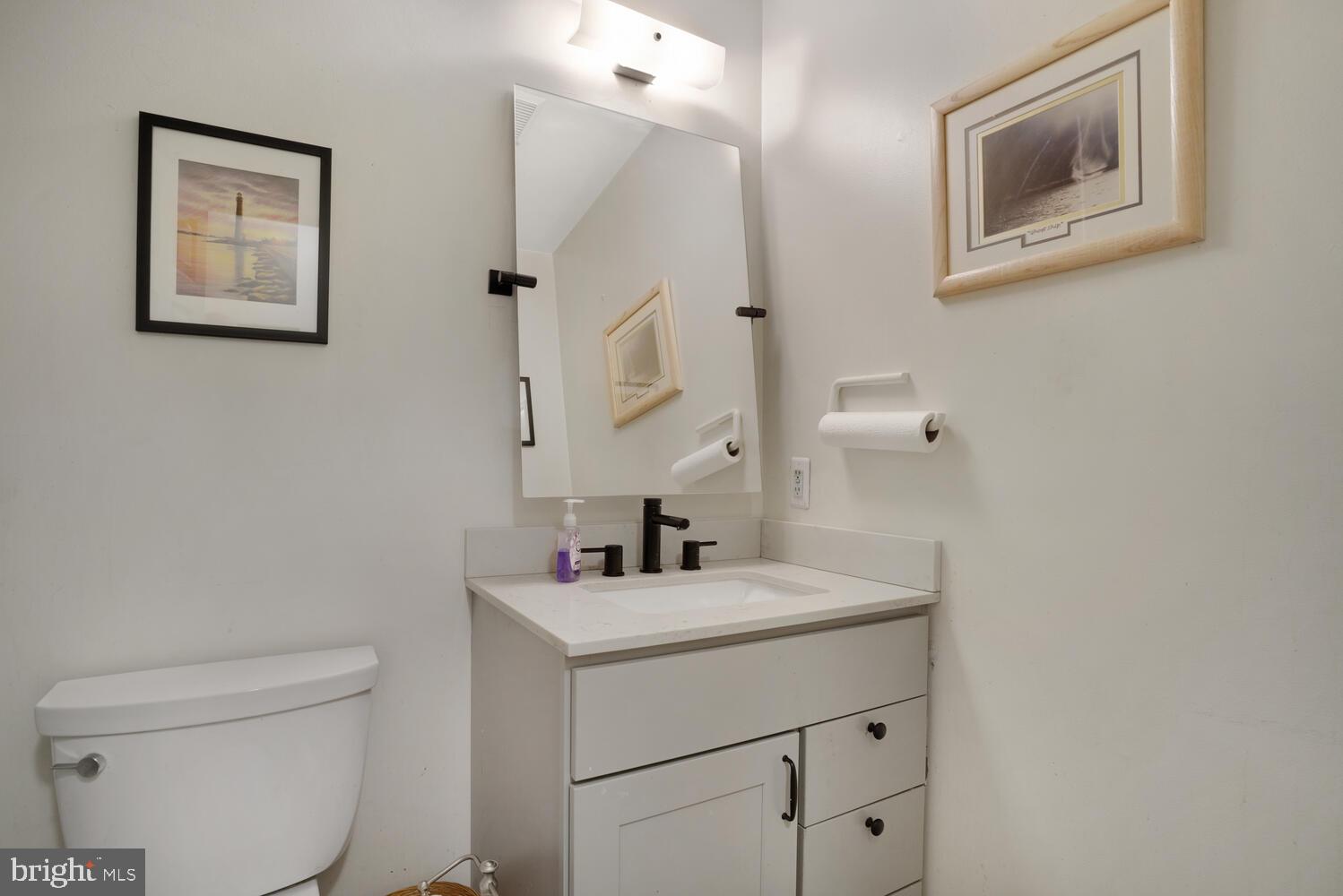 1321 Radio Road Little Egg Harbor, NJ 08087 - Photo 23 of 32 a bathroom with a toilet sink and mirror