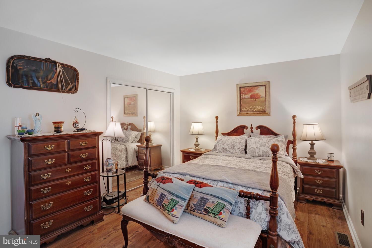 1321 Radio Road Little Egg Harbor, NJ 08087 - Photo 25 of 32 a bedroom with a bed and wooden floor