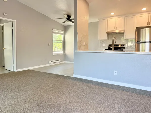 a view of a kitchen with a sink and a window