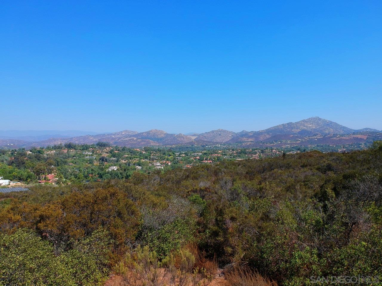 7 Del Poniente Road Poway, CA 92064 - Photo 17 of 26 a view of a lush green field