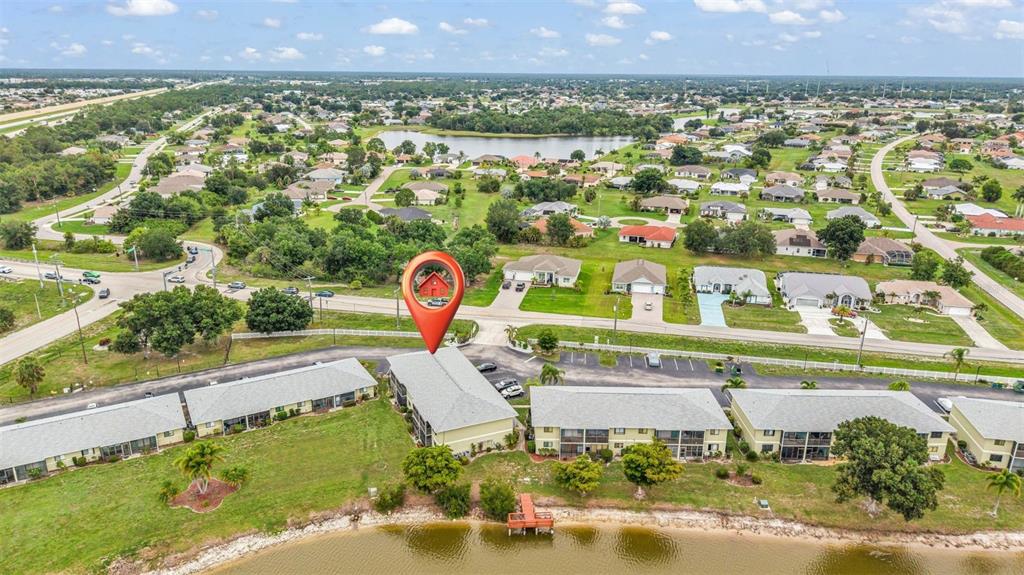 25225 Rampart Boulevard, Unit 1604 Punta Gorda, FL 33983 - Photo 31 of 41 an aerial view of a house with a pool yard and outdoor seating