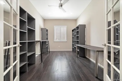 a view of walk in closet with wooden floor and floors