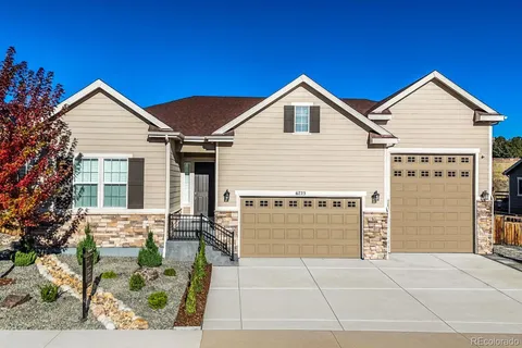 a view of house with yard