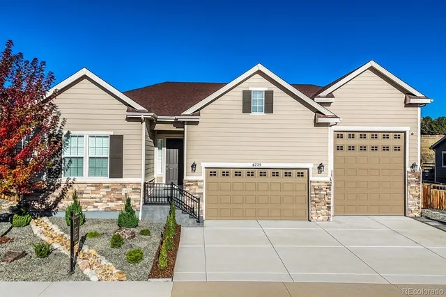 a view of house with yard