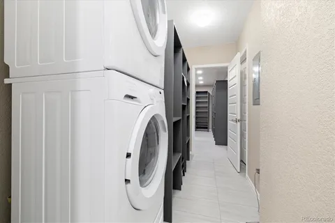 a view of a hallway with washer and dryer