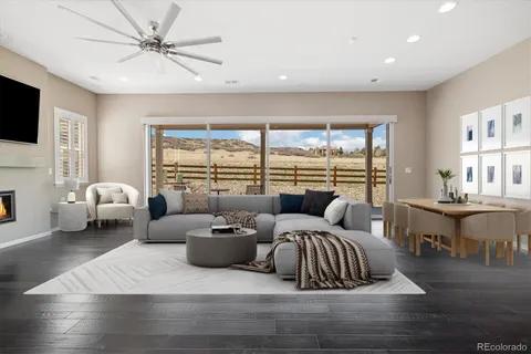 a bedroom with furniture and a large window