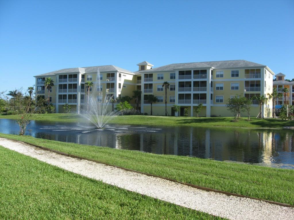 8411 Placida Road, Unit 407 Placida, FL 33946 - Photo 1 of 1 a front view of a house with a yard