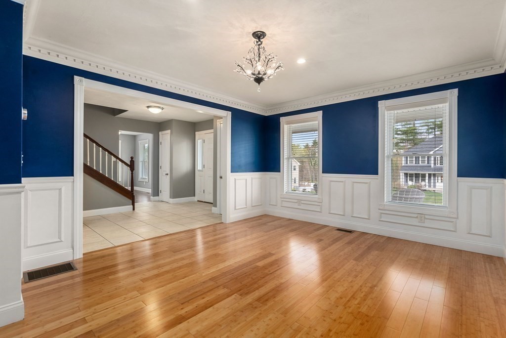 38 Draper Woods Road Sturbridge, MA 01518 - Photo 17 of 42 a view of an empty room with wooden floor and a window