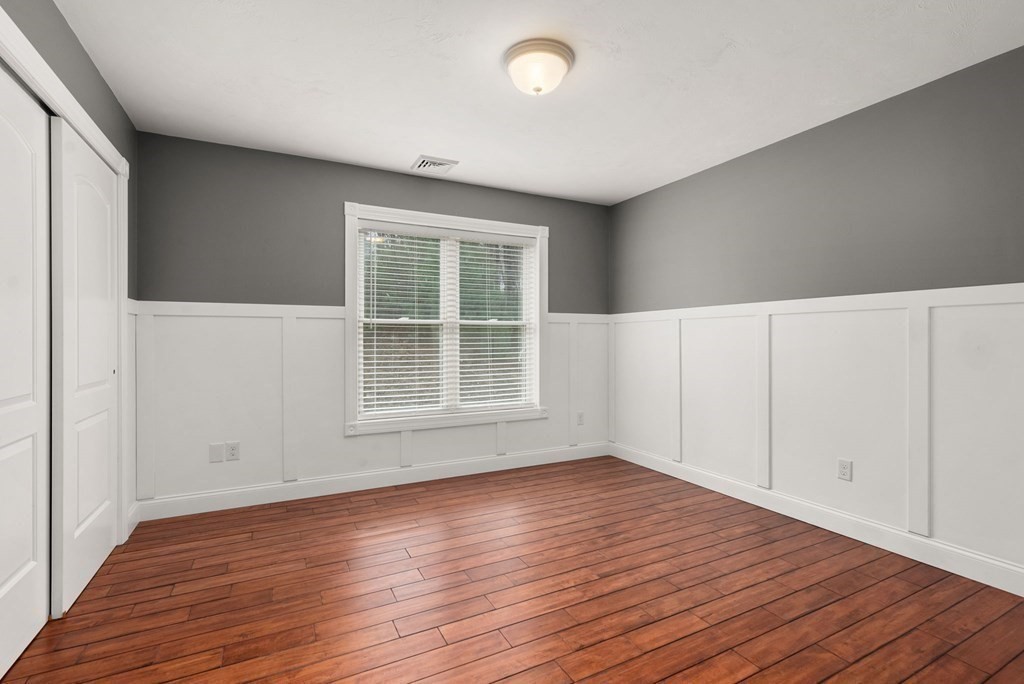 38 Draper Woods Road Sturbridge, MA 01518 - Photo 28 of 42 wooden floor in an empty room with a window