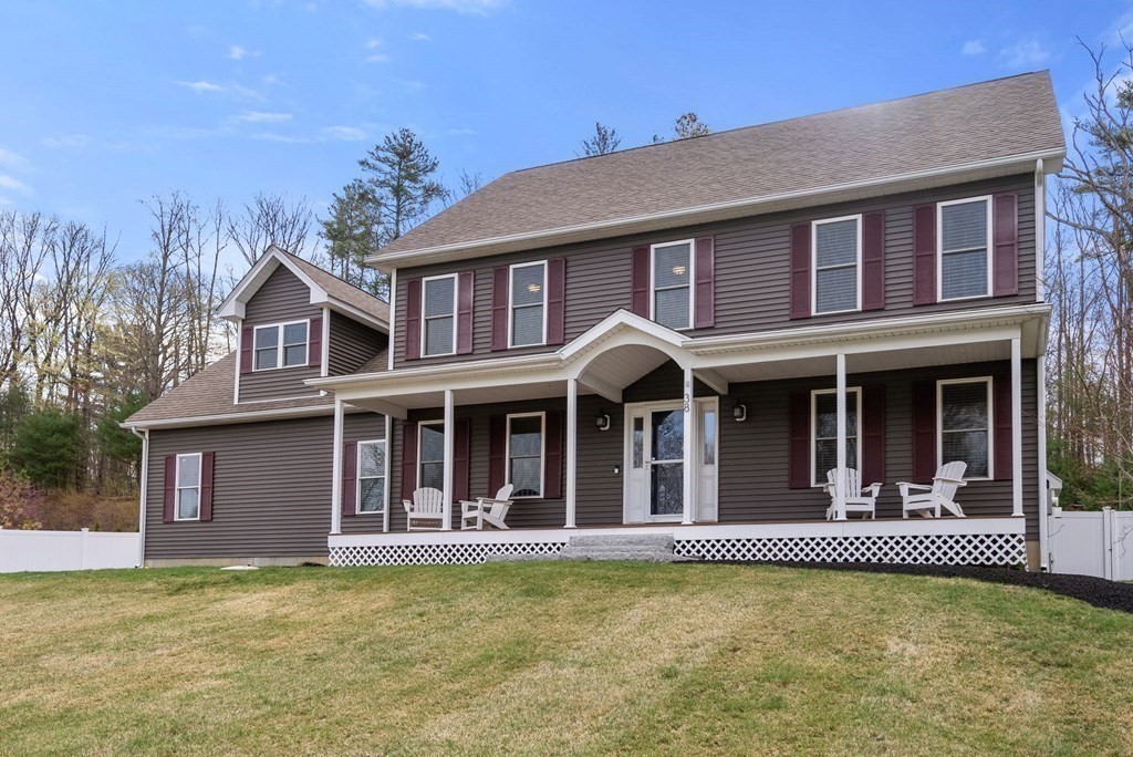 38 Draper Woods Road Sturbridge, MA 01518 - Photo 3 of 42 a view of a large building with large windows and a large tree