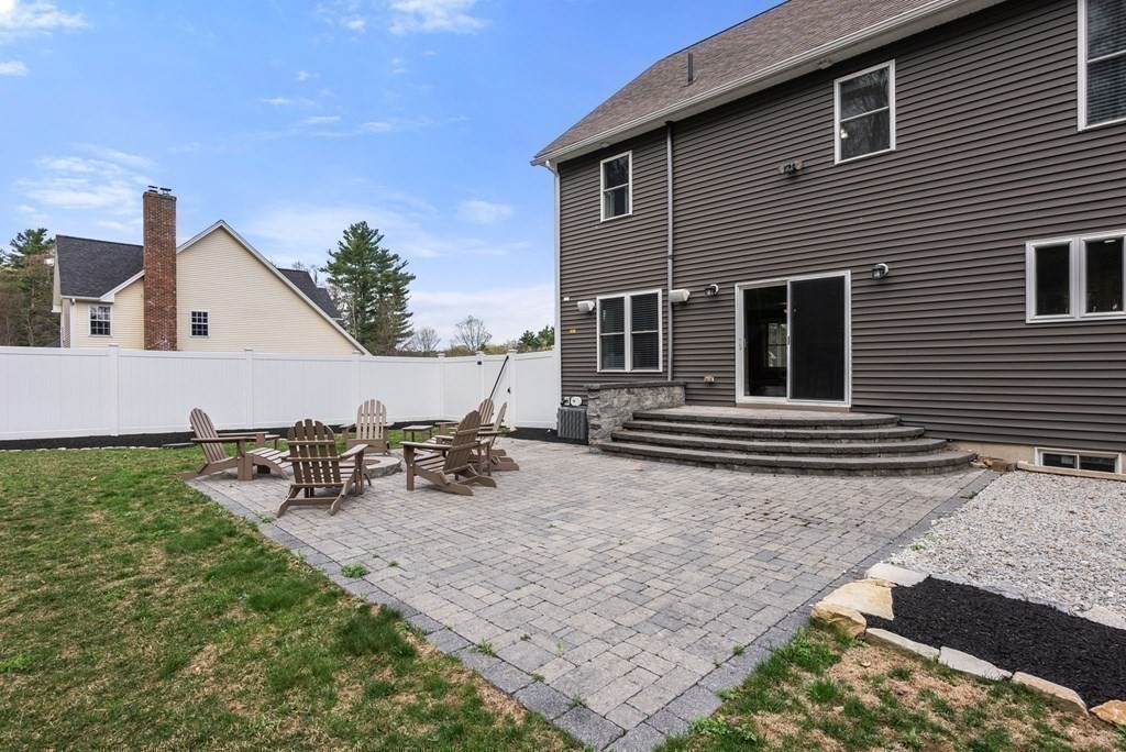 38 Draper Woods Road Sturbridge, MA 01518 - Photo 32 of 42 a view of a house with backyard and sitting area