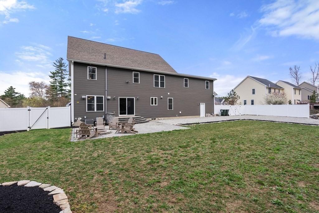 38 Draper Woods Road Sturbridge, MA 01518 - Photo 33 of 42 a front view of a house with garden