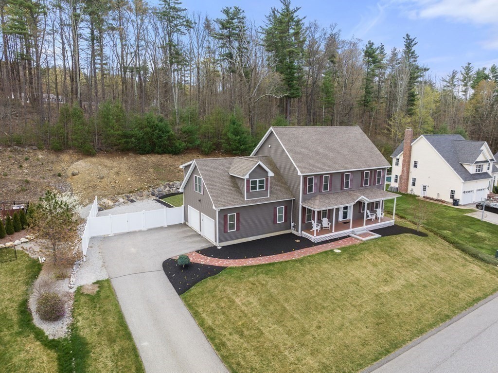 38 Draper Woods Road Sturbridge, MA 01518 - Photo 38 of 42 an aerial view of a house with swimming pool and large trees