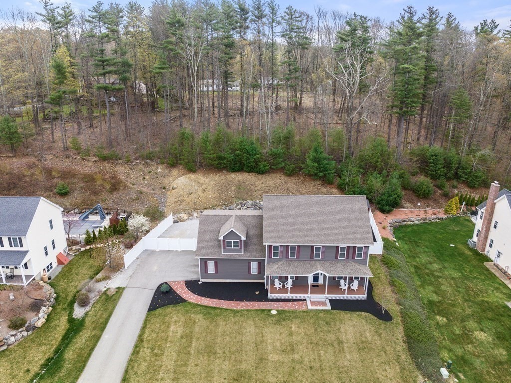 38 Draper Woods Road Sturbridge, MA 01518 - Photo 39 of 42 an aerial view of a house with swimming pool and large trees