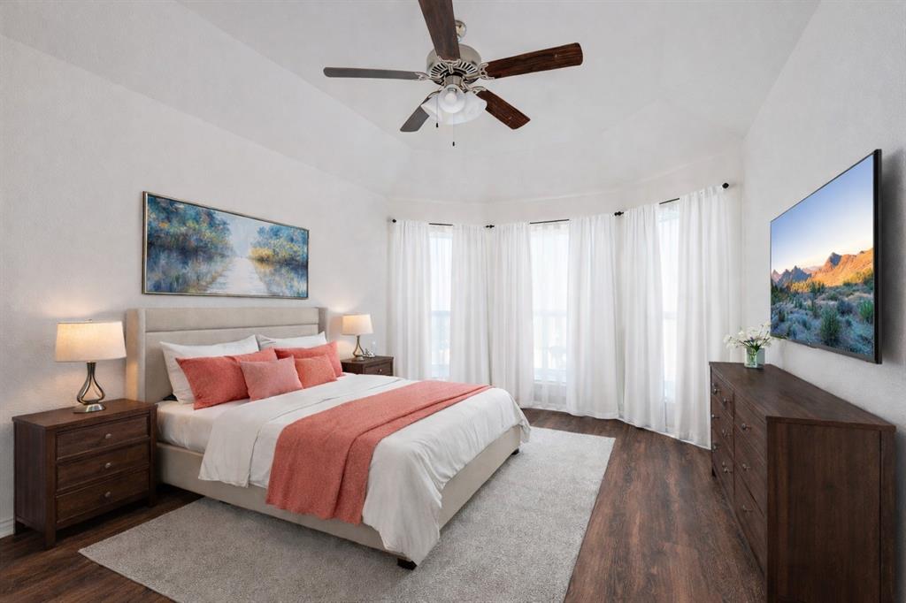 1500 Elizabeth Street Anna, TX 75409 - Photo 5 of 25 a bedroom with a bed flat screen tv and a chandelier