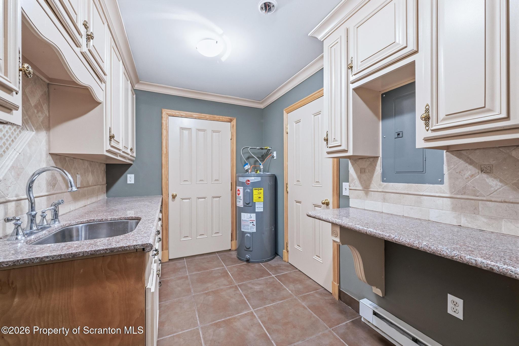 116 Forge Street Old Forge, PA 18518 - Photo 13 of 49 a kitchen with stainless steel appliances granite countertop a refrigerator and a sink