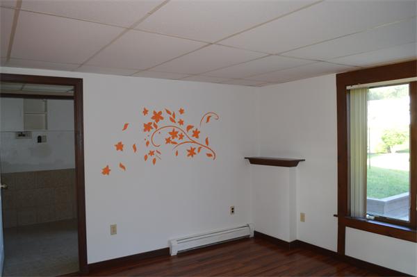 124 Ramshorn Road Dudley, MA 01571 - Photo 29 of 29 a view of an empty room with wooden floor and a window