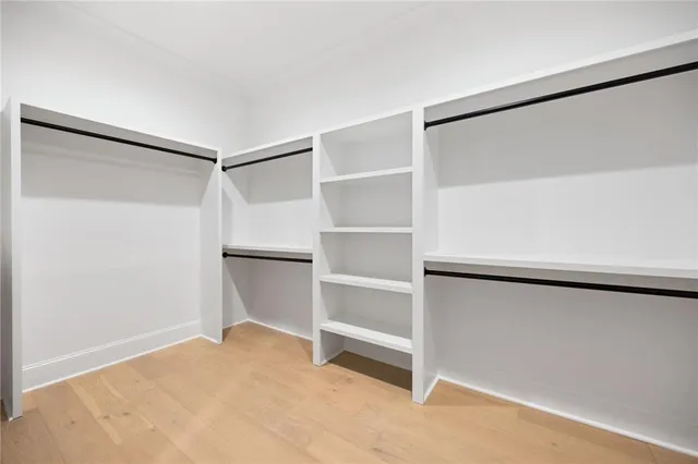 a view of an empty room with a closet