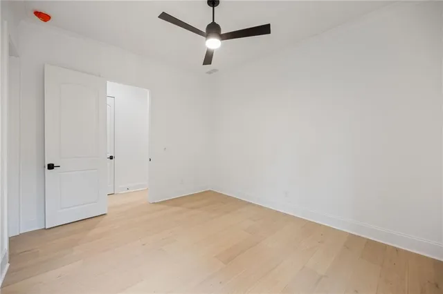a view of a room with a ceiling fan