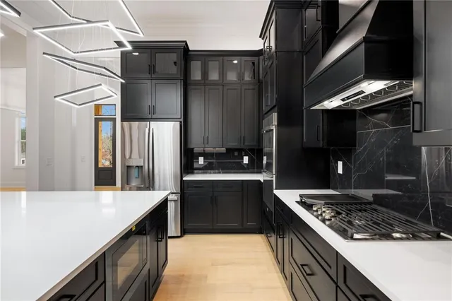 a kitchen with a stove and a refrigerator