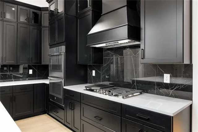 a kitchen with a stove and a refrigerator