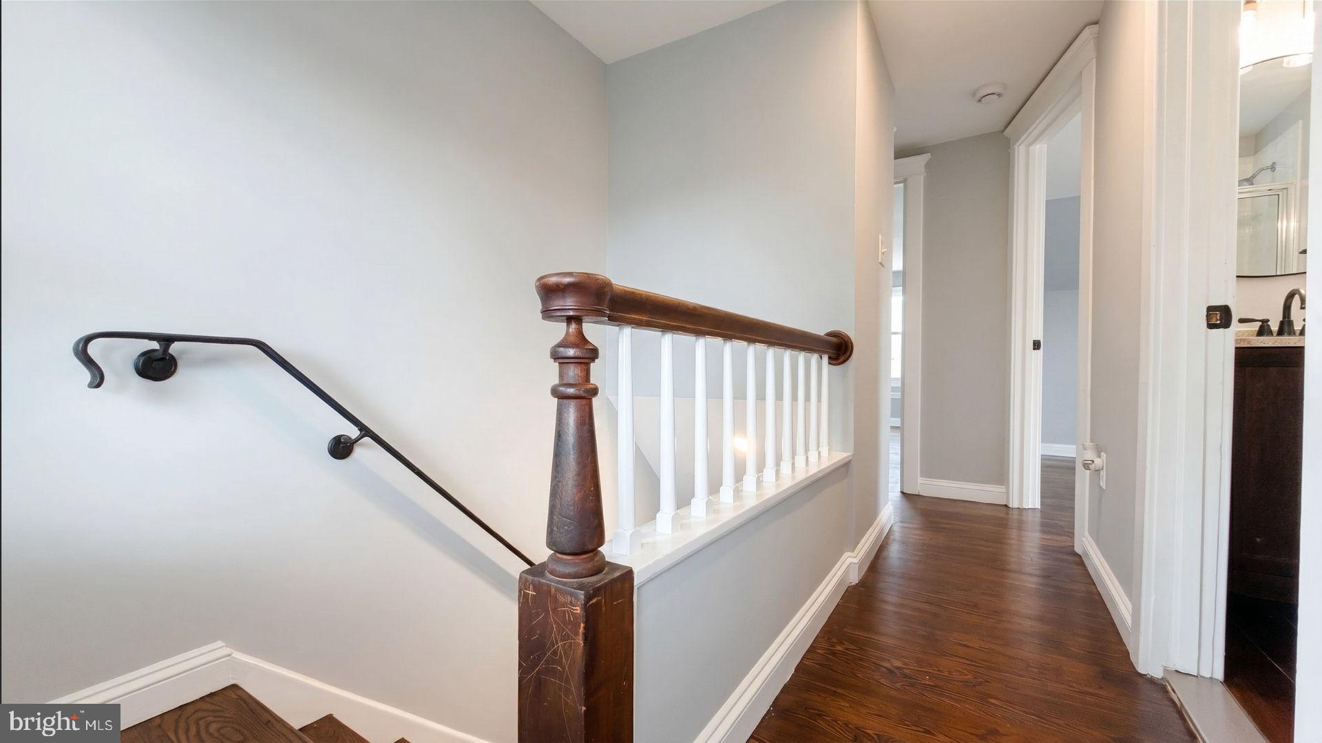 154 Andrew Street Hamilton, NJ 08610 - Photo 19 of 29 a view of a hallway with wooden floor and staircase
