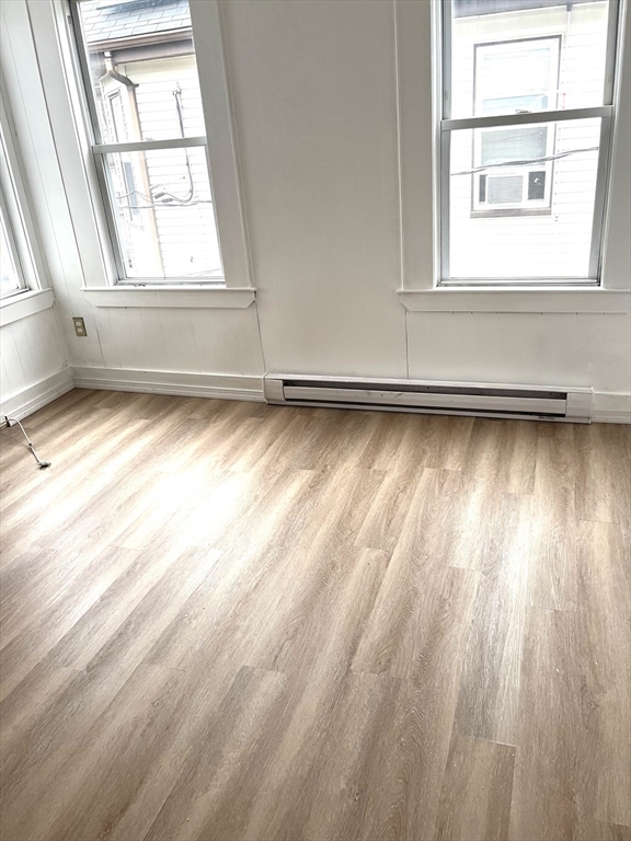 92 Emory Street, Unit 1 Attleboro, MA 02703 - Photo 6 of 8 a view of a room and window
