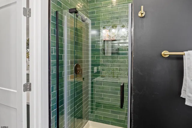 a bedroom with a bed dresser and a window