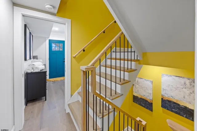 a bed room with a bed and a lamp