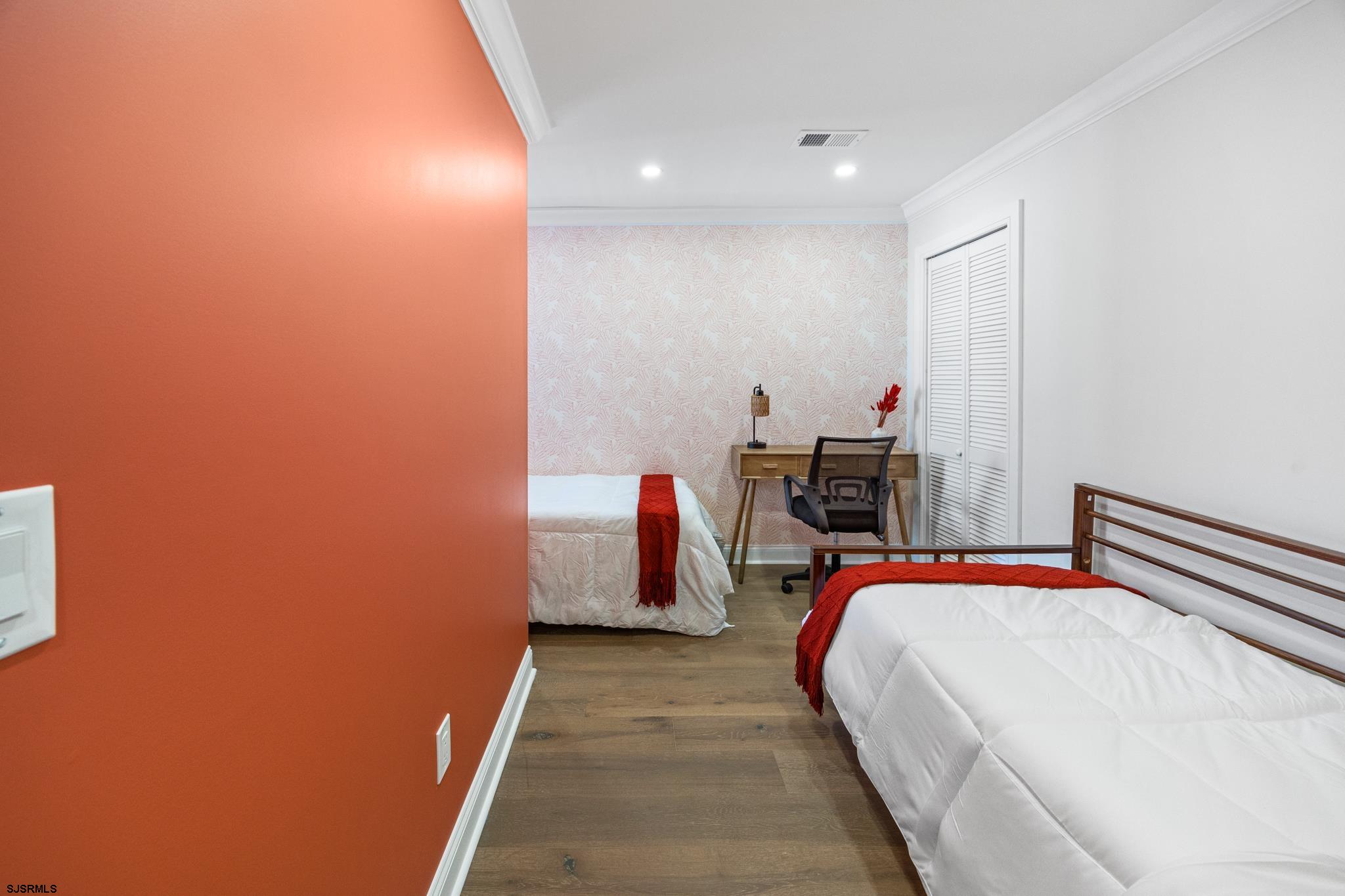 129 Seaside Avenue Atlantic City, NJ 08401 - Photo 15 of 43 a bed room with a bed and a lamp