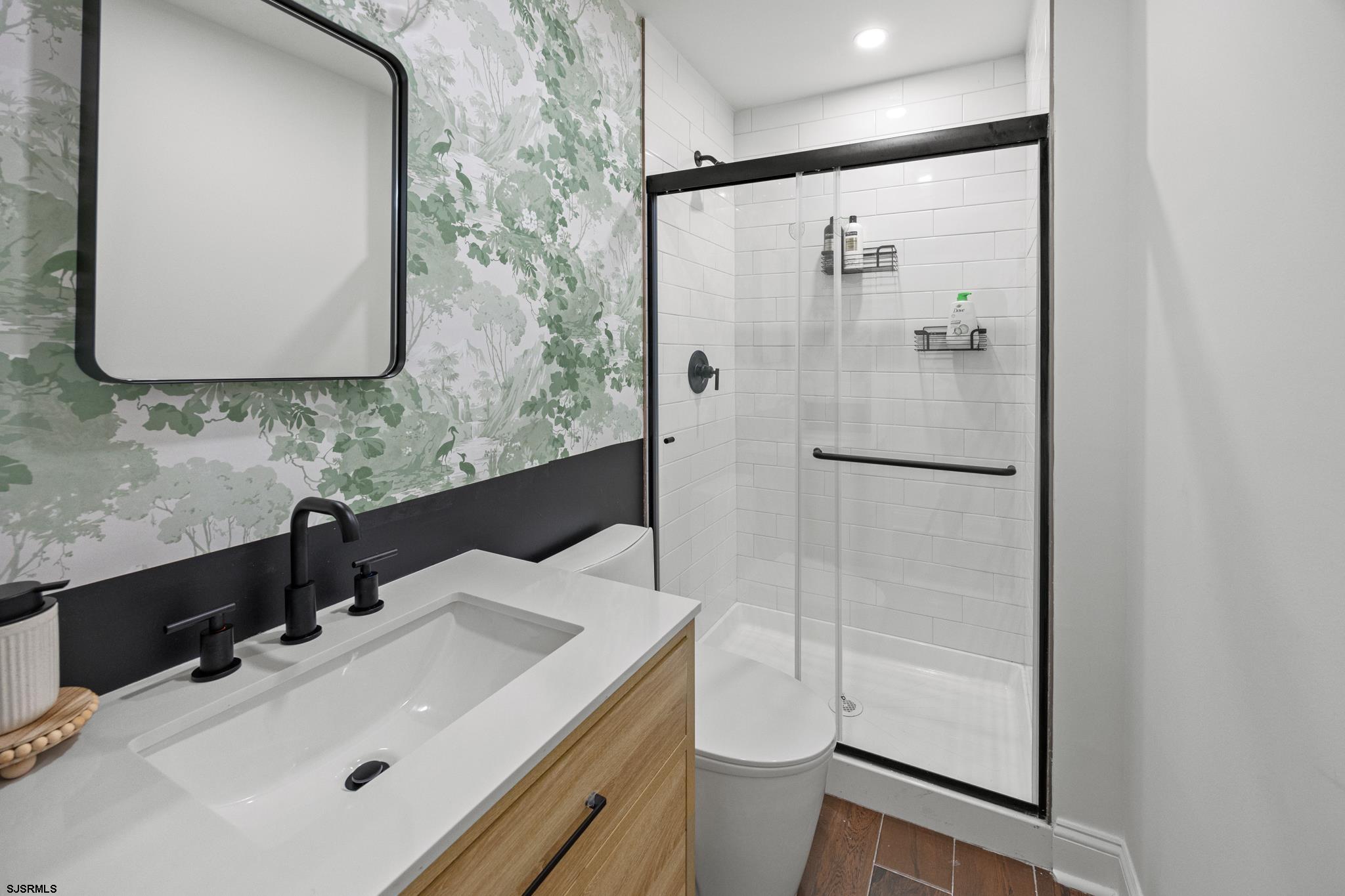 129 Seaside Avenue Atlantic City, NJ 08401 - Photo 19 of 43 a bathroom with a sink toilet and shower