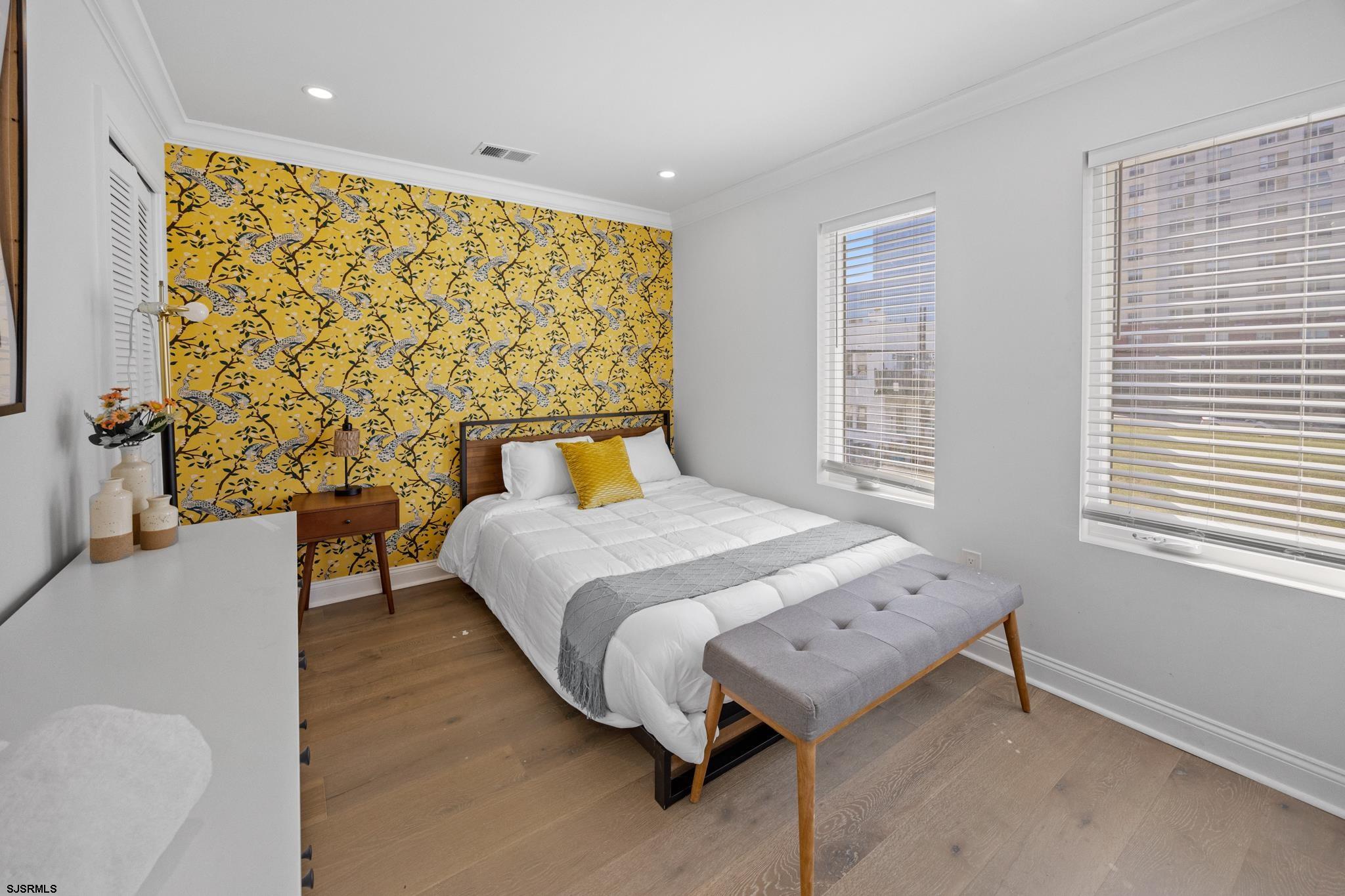 129 Seaside Avenue Atlantic City, NJ 08401 - Photo 20 of 43 a bedroom with a bed and a table