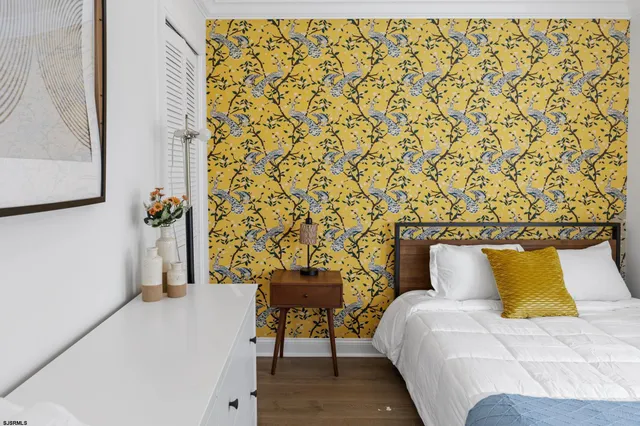 a bedroom with a bed and a table