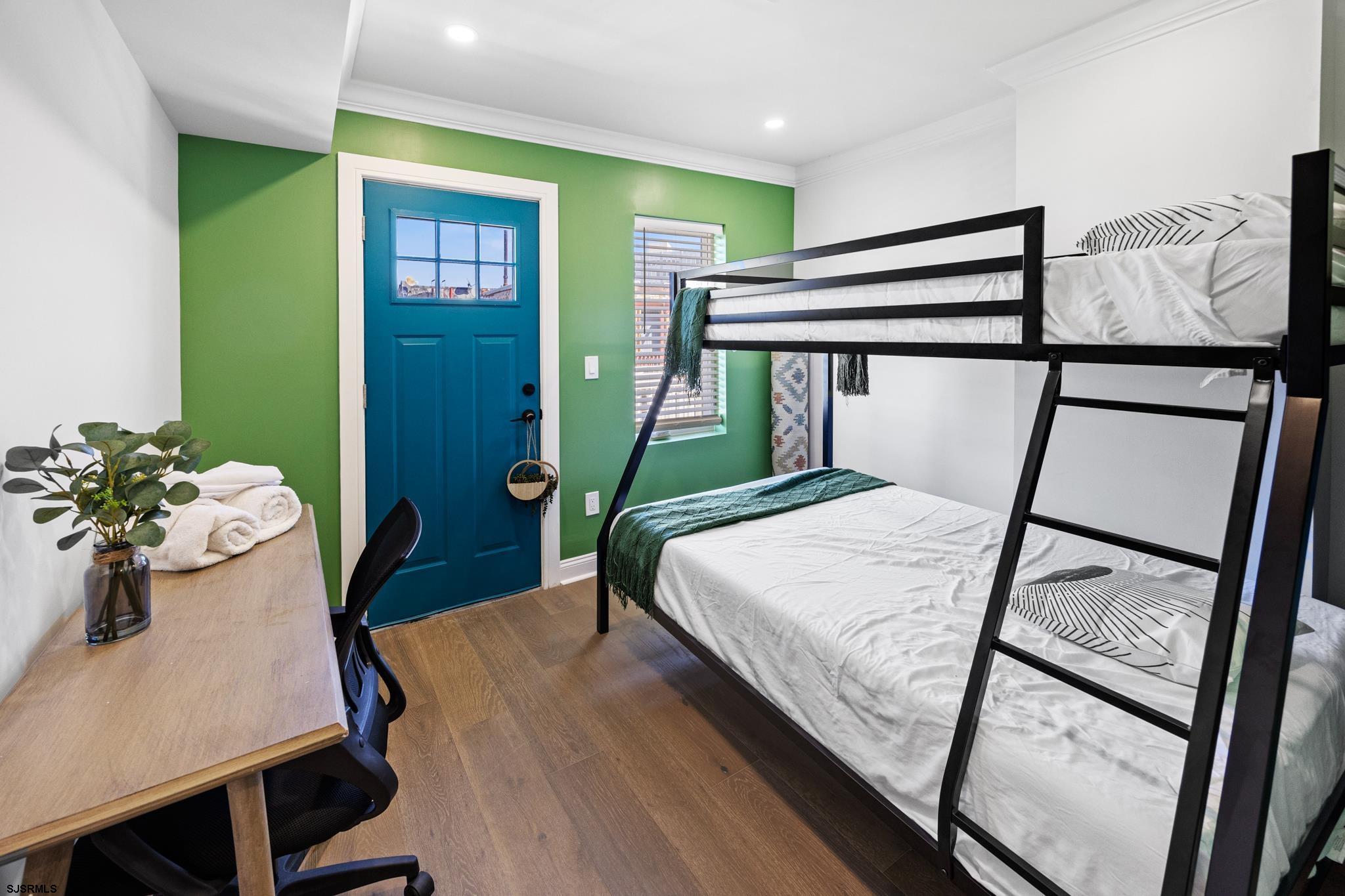 129 Seaside Avenue Atlantic City, NJ 08401 - Photo 22 of 43 a bedroom with a bed and a table