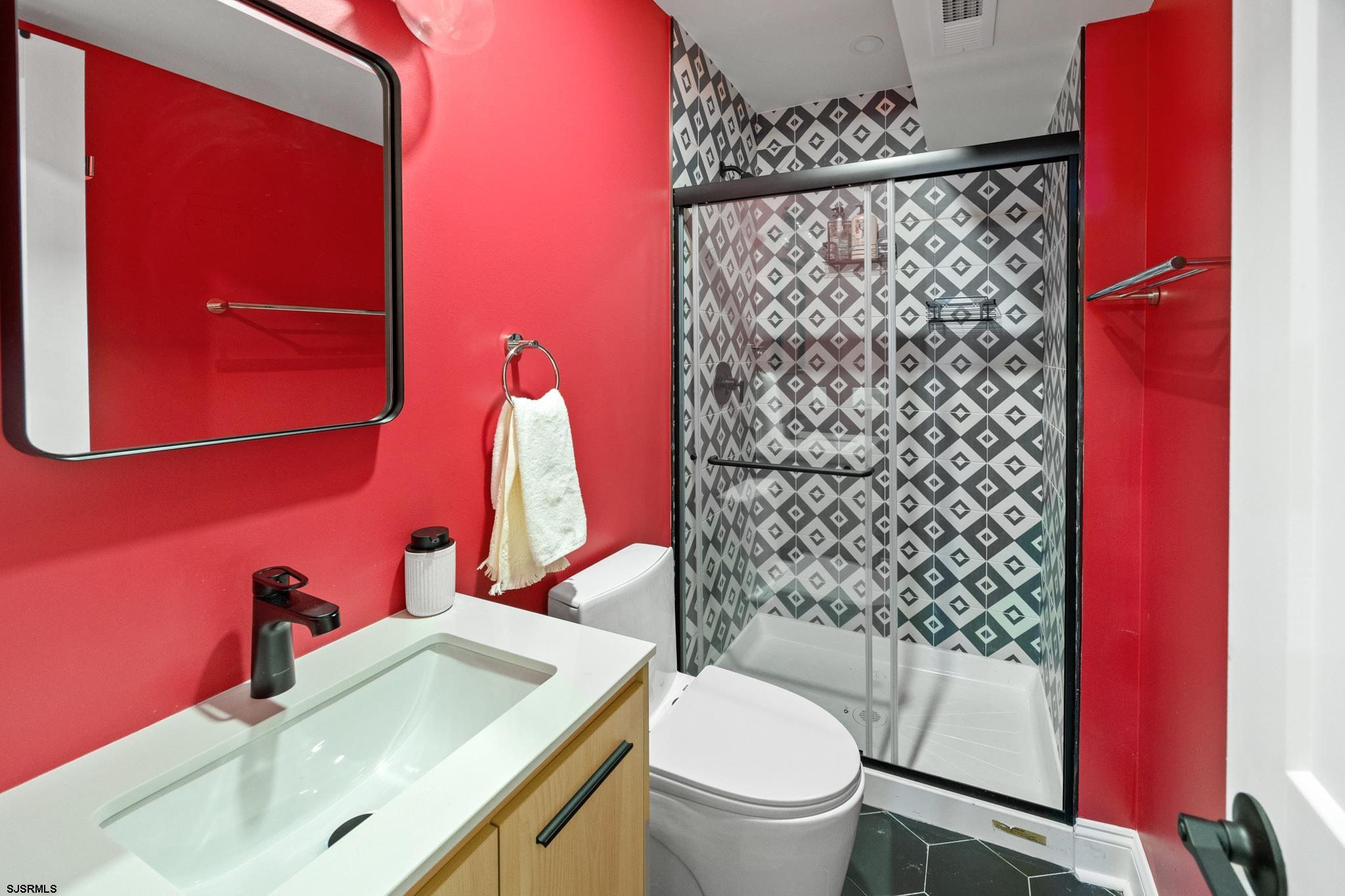 129 Seaside Avenue Atlantic City, NJ 08401 - Photo 25 of 43 a bathroom with a sink toilet and shower