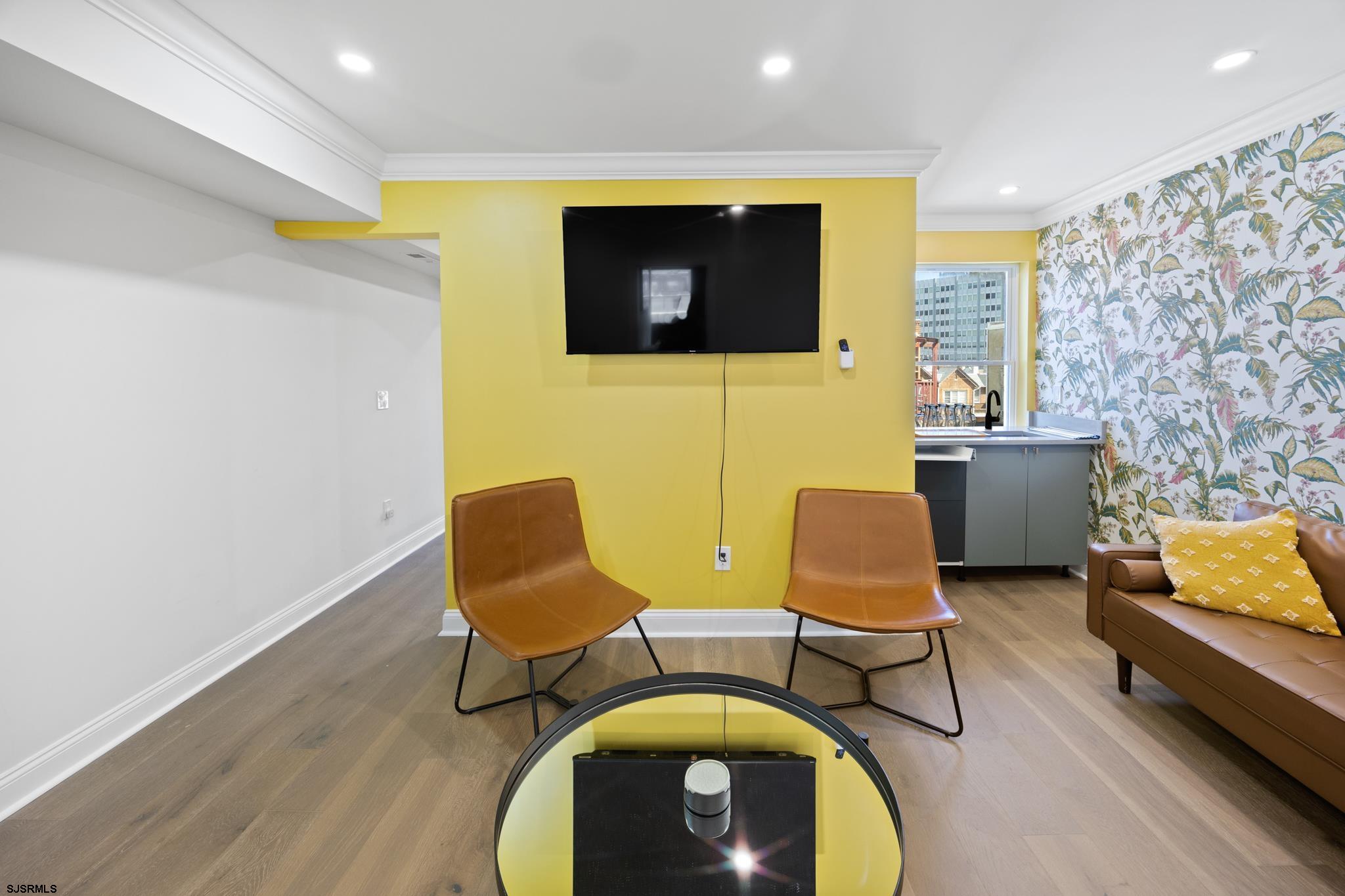 129 Seaside Avenue Atlantic City, NJ 08401 - Photo 31 of 43 a living room with furniture and a flat screen tv