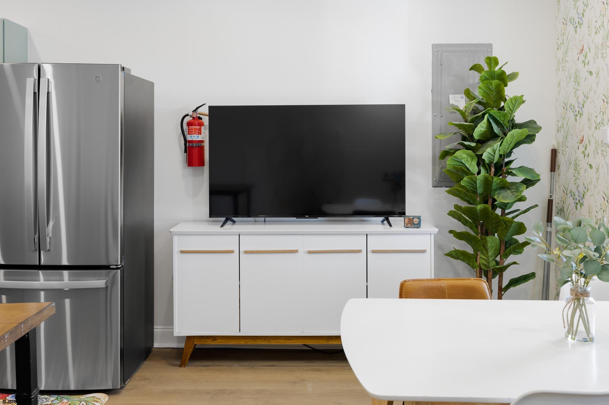 129 Seaside Avenue Atlantic City, NJ 08401 - Photo 34 of 43 a living room with furniture and a flat screen tv