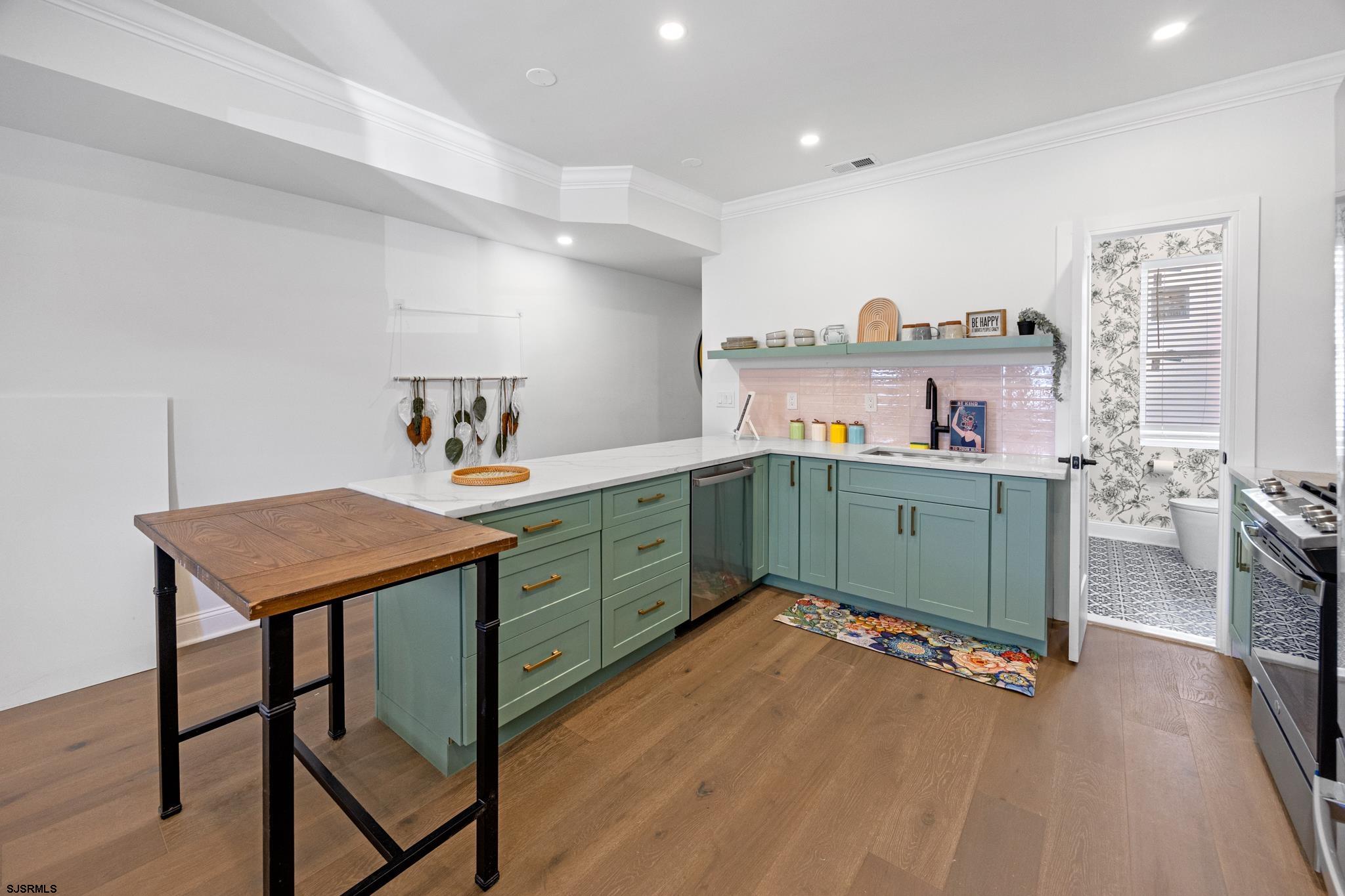 129 Seaside Avenue Atlantic City, NJ 08401 - Photo 6 of 43 a room with a dresser and a wooden floor