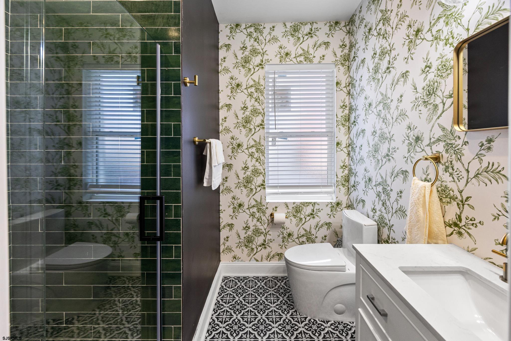 129 Seaside Avenue Atlantic City, NJ 08401 - Photo 9 of 43 a bathroom with a sink toilet and shower