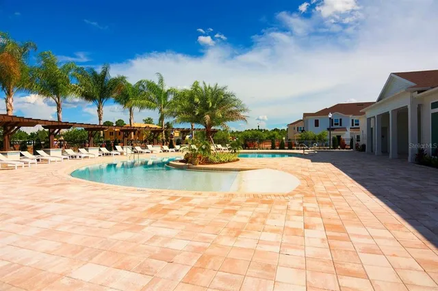 a view of swimming pool with lounge chair
