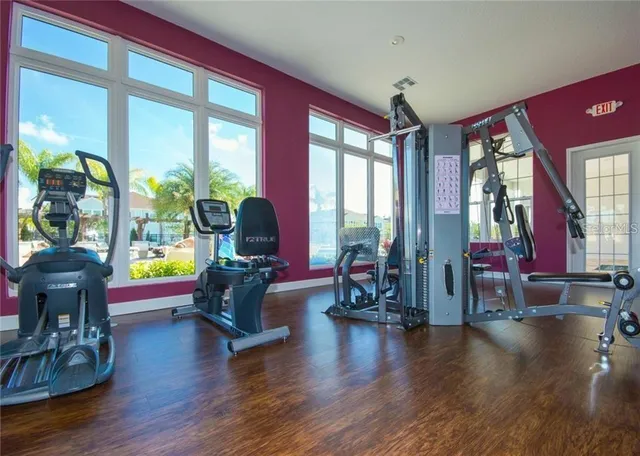 a living room with fireplace furniture and a large window