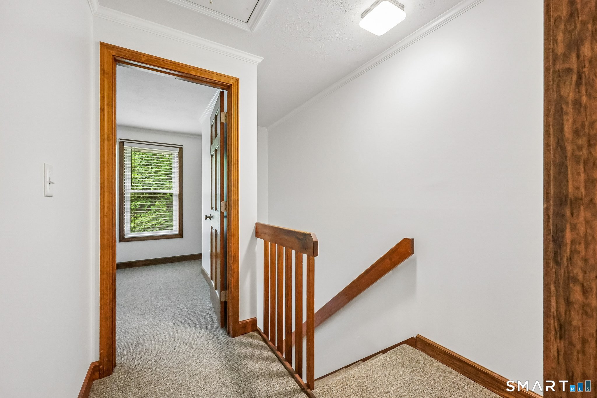 65 Old Route 79, Unit 5 Madison, CT 06443 - Photo 23 of 28 Above the top of the staircase is an attic storage area you will access with pull down stairs