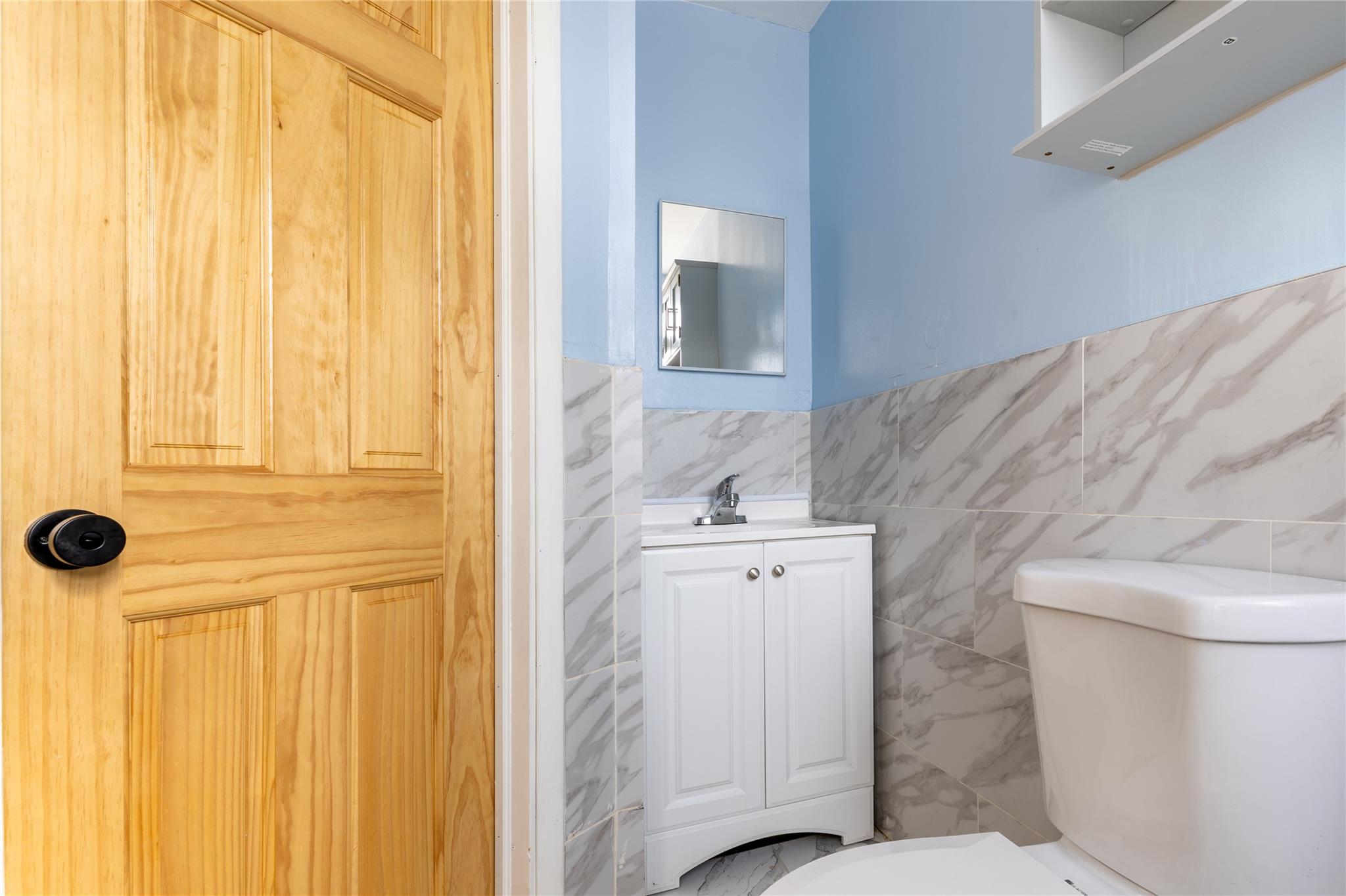 154 South 3rd Street, Unit 24 Brooklyn, NY 11211 - Photo 14 of 17 a bathroom with a sink and toilet