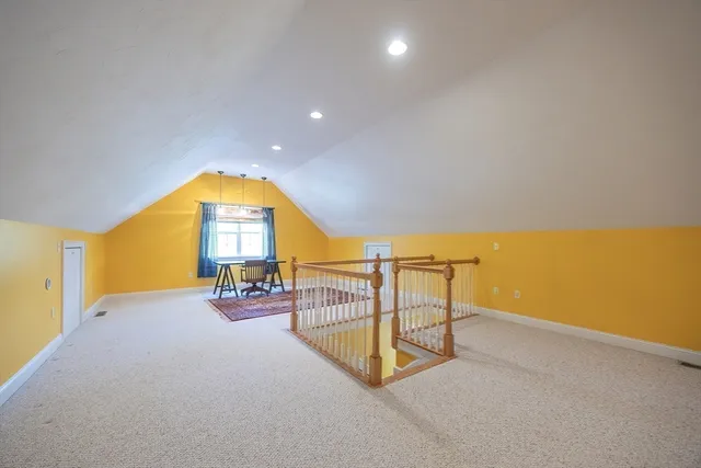 a view of a chair and table in the balcony